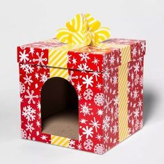 a red and yellow gift box with snowflakes on it