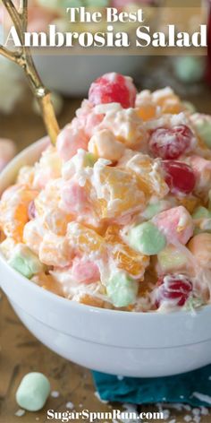 a bowl filled with fruit salad on top of a table