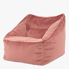 a pink bean bag chair sitting on top of a white floor