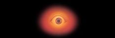 an eyeball is shown in the dark with red and yellow light coming from it