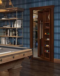 a pool table in front of a book shelf