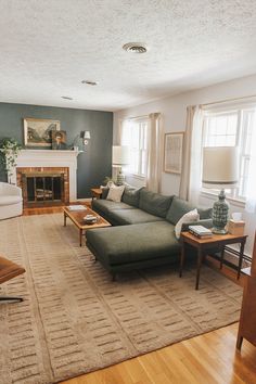 a living room filled with furniture and a fire place