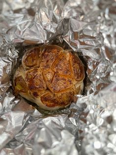 a piece of food sitting on top of aluminum foil