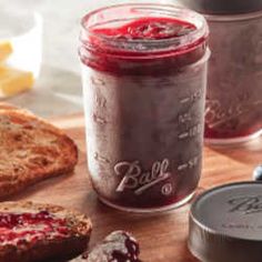 some bread and jam are sitting on a table