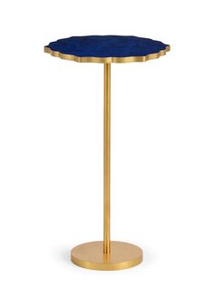 a gold and blue table with a round top on a white background, it is also available for use as a side table