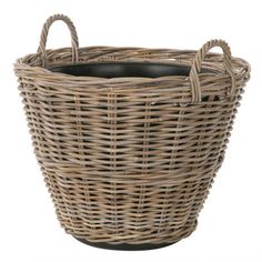 a large wicker basket with handles on an isolated white background for use as a planter