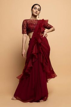 Burgundy pre-draped saree in organza base. Paired with a floral bead, pearl and cutdana embroidered padded blouse and embellished belt. - Aza Fashions Formal Pre-draped Saree With Ruffles, Festive Formal Pre-draped Saree With Ruffles, Formal Festive Ruffled Pre-draped Saree, Formal Georgette Saree With Ruffles, Elegant Semi-stitched Saree With Ruffles, Elegant Semi-stitched Ruffled Saree, Formal Georgette Pre-draped Saree With Ruffles, Formal Pre-draped Georgette Saree With Ruffles, Formal Pre-draped Ruffled Georgette Saree