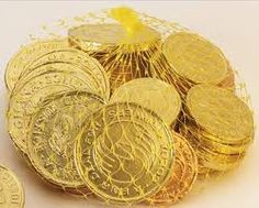 a bunch of gold coins sitting on top of each other