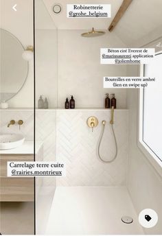 an image of a bathroom with white tile and gold fixtures on the shower head, mirror, sink, and bathtub