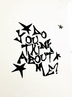 a black and white drawing on the side of a wall that says do you think about me?