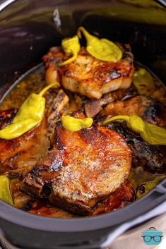 some meat in a pot with yellow sauce