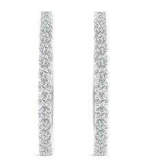 This classic pair of matching earrings features 34 round brilliant cut natural diamonds. All diamonds are prong set in 10k white gold. The earrings are secured by a notched post. Diamond White Diamond Earrings With Channel Set, Channel Set Diamond Earrings In White Gold, White Gold Channel Set Diamond Earrings, Channel Set White Gold Diamond Earrings, White Gold Diamond Earrings With Channel Set, Classic Diamond White Earrings With Channel Set, White Round Channel Set Diamond Earrings, White Diamond Channel Set Earrings, White Diamond Earrings Channel Set Round Cut