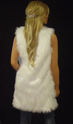 Classic and chic White Angora faux fur long vest with deep pockets on both sides and hidden hook and eye front closure. Extremely soft and luxurious high quality faux fur! Great fitting and easy to wear makes this the perfect way to add a little style to any dressy or casual attire. Fully lined with high quality satin. 100% high quality soft faux fur. Hand made in the USA. Sizes available in S, M, L, XL Hand wash cold, hang to dry. Most items from our shop ship within 1-2 business days. VIEW PIC Sleeveless Fur Coat With Faux Fur Trim, Sleeveless Faux Fur Coat With Fur Trim, Sleeveless Faux Fur Coat, Fitted Faux Fur Vest With Faux Fur Lining, Fur Leg Warmers, Faux Fur Shrug, Fur Shrug, Long Vest, Long Vests