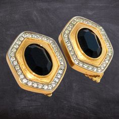 Elevate your style with these stunning Vintage LANVIN Earrings, signed Lanvin Germany and adorned with elegant black crystals surrounded by dazzling Swarovski diamante crystals. These geometric clip-on earrings feature a bold black glass domed hexagon design, crafted in Paris and made in Germany by the renowned couture design house of Jeanne Lanvin, founded in 1889. The gold-plated finish adds a luxurious touch to these statement pieces, making them the perfect accessory for lovers of retro fash Luxury Retro Clip-on Earrings, Formal Black Clip-on Earrings, Formal Jeweled Metal Clip-on Earrings, Classic Black Clip-on Earrings For Evening, Evening Metal Clip-on Crystal Earrings, Elegant Evening Metal Crystal Clip-on Earrings, Metal Clip-on Crystal Earrings For Evening, Elegant Black Crystal Rhinestone Earrings, Elegant Black Rhinestone Earrings