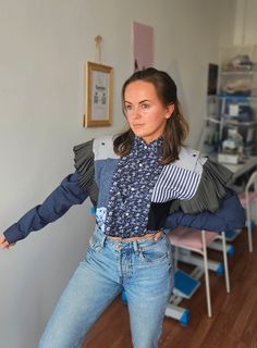 These upcycled handmade shirts are made from men's shirts that could have turned into waste, giving them a second life. The blouse is decorated with charming ruffles, open shoulders give freedom, the black and blue tones are easily combined with jeans or classic trousers. Feel the individuality with our unique blouses that combine slow fashion, sustainability and exclusive charm. These handmade shirts will make a great gift for your mother, sister or someone who appreciates a unique handmade sty Fitted Cotton Patchwork Tops, Fitted Cotton Shirt With Patchwork, Fitted Cotton Patchwork Shirt, Cotton Patchwork Crop Top, Blue Long Sleeve Reworked Tops, Reworked Cotton Long Sleeve Tops, Blue Reworked Long Sleeve Top, Handmade Shirts, Classic Trousers