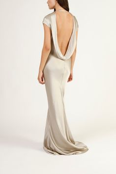 the back of a woman in a white gown