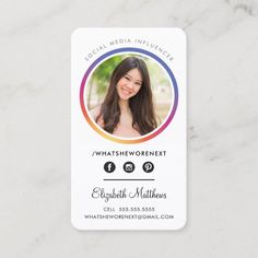 a white business card with an image of a woman's face on the front