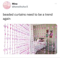 a room with hearts hanging from the ceiling and pink curtains on the wall behind it