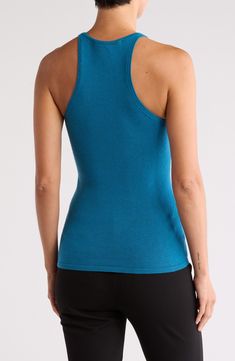 A merino-wool blend enhances the look and feel of this shell tank that's a timeless piece whether for in-office or off-duty days. 25 1/2" length (size Small)
 V-neck Sleeveless 47% merino wool, 40% cotton, 11% nylon, 2% spandex Hand wash, dry flat Imported Fitted Casual Merino Wool Tops, Stretch Merino Wool Tops In Solid Colors, Stretch Merino Wool Solid Color Tops, Fitted Merino Wool Tops For Layering, Nylon Tops With Built-in Bra And Stretch, Stretch Merino Wool Solid Top, High Stretch Nylon Tank Top With Built-in Bra, Nylon Tank Top With Built-in Bra And Medium Support, Blue Medium Support Moisture-wicking Tank Top