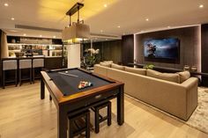 a pool table in the middle of a living room