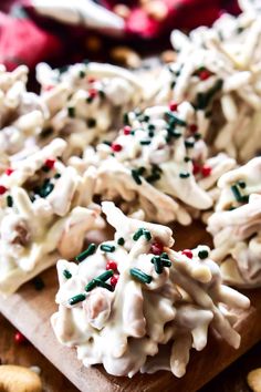 christmas cookies on a cutting board with sprinkles