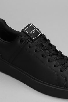 B court Sneakers in black leather, laces, rubber outsole, logo on heel, 100% leather, Made in ItalyGender: MenMaterial: LEATHERColor: BlackMade in: FRProduct ID: 366446_DM1VI288LVTR*Import tax/duty will be calculated at checkout (If applicable) Modern Black Sneakers With Embossed Logo, Luxury Black High-top Sneakers With Logo, Luxury Black Sneakers With Embossed Logo, Modern Black High-top Sneakers With Logo, Luxury Black Lace-up Sneakers, Luxury Black Sneakers With Logo, Balmain Paris, Black Leather, Heels