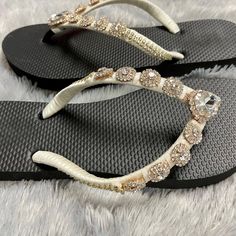 These Beautiful Satin Bridal Flip Flops with rhinestone are the perfect gift for a Wedding. These Flip Flops are hand wrapped in satin ribbon and embroidered with small rhinestone. These are available in ladies sizes 7,8,9,10 Black Flat flip flops (pictured) . When ordering this item, please specify the size in the notes box I can do your flip flops in your wedding colors. Awesome for beach/ Summer weddings and as bridal party, flower girl & Mom gifts!! Made to Order: Orders are processed and sh White Crystal Bridal Accessories With Rhinestones, Elegant Bedazzled Bridal Accessories For Party, Crystal Rhinestone Bridal Accessories For Party, Crystal Bridal Accessories With Rhinestones For Party, Adjustable Rhinestone Bridal Accessories For Wedding, White Crystal Bridal Accessories With Adjustable Fit, Silver Bedazzled Bridal Accessories For Party, Party Crystal Embellished Bridal Accessories, White Crystal Bridal Accessories For Anniversary