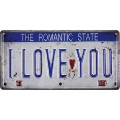 an old license plate with the words i love you written in red and blue on it