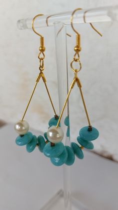 Summery, handmade teardrop-shaped earrings. Decorated with white pearls, small gold spacers and turquoise beads. They don't weigh. Gold Teardrop Earrings With Spacer Beads, Turquoise Teardrop Pearl Drop Earrings, Handmade Turquoise Teardrop Earrings With Round Beads, Handmade Turquoise Dangle Pearl Earrings, Summer Earrings, Summer Earring, Turquoise Beads, Pearl White, Favorite Jewelry