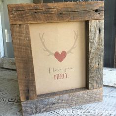 an old wooden frame with a deer's head and i love you derby written on it