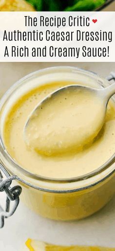 a spoon full of cream sauce on top of a white table with the words recipe crick authentic caesar dressing