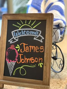 a chalkboard sign that says welcome to james johnson and an ice cream cone on it