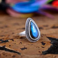 》Description 《 Big Teardrop Labradorite Ring Sterling Silver Ring, Genuine Blue Labradorite Ring, Pear Labradorite Gemstone, Gift For Her, Boho Ring 》D E T A I L S《 ✦Stone :-  Labradorite ✦Stone Size:-10x20 MM ✦Stone Shape:-Pear ✦Stone Type:- Natural ✦Metal:- Silver, Brass ✦Purty:- 925 Sterling Silver ✦Weight:- 8 Gram (Approx) ✦Ring Size:- All Size Available 》C U S T O M I Z E O R D E R《 We accept custom and personalized order. It can be change in the gemstone, earring design and earring size. P Bohemian Teardrop Gemstone Ring, Bohemian Round Labradorite Crystal Ring, Bohemian Oval Labradorite Rings, Bohemian Labradorite Gemstone Ring, Bohemian Style Labradorite Open Ring, Bohemian Labradorite Open Ring, Blue Bohemian Moonstone Ring, Bohemian Blue Labradorite Rings, Blue Moonstone Ring With Natural Stones Bohemian Style