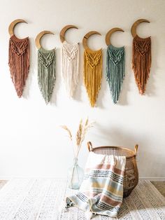 the wall is decorated with macrami and tassels for hanging on it