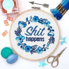 a cross stitch kit with scissors and thread