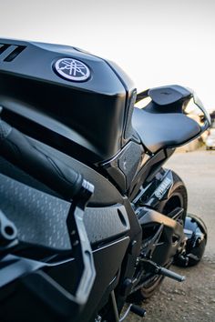 two motorcycles parked side by side on the street