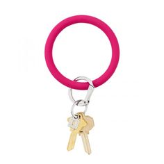 a pink ring with two keys attached to it