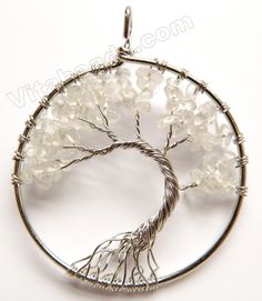 the tree of life pendant is made from wire and glass beads