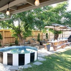 an above ground swimming pool surrounded by tables and umbrellas