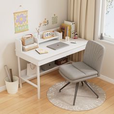 a white desk with a laptop computer on top of it next to a gray chair