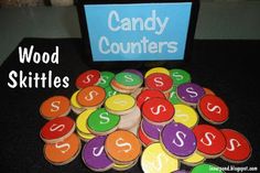 candy counters are stacked on top of each other in front of a sign that says candy counters wood skittles