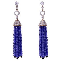 A beautiful work of art with Faceted Sapphire Bead Tassels with Diamonds and Onyx. There are 89.51 cts. of Sapphire, 1.64 cts of Onyx, and 3.33 cts of Diamonds The earrings weighs 28.29 grams. Luxury Blue Beaded Earrings, Cheap Blue Elegant Beaded Earrings, Luxury Dangle Earrings With Faceted Details, Luxury Faceted Dangle Earrings, Luxury Latkans Earrings For Formal Occasions, Bead Tassels, Sapphire Beads, Earrings With Diamonds, Beaded Tassel Earrings