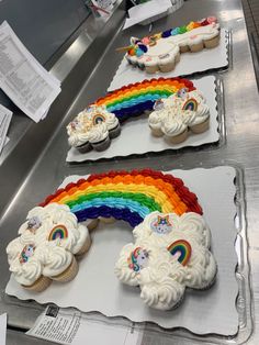 cupcakes with rainbow frosting and icing on trays