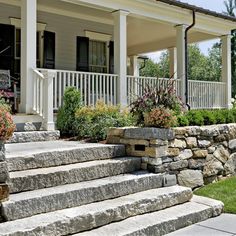 stone steps lead up to the front door of a house