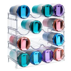 the multi - tiered rack holds many different colored cups