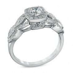 Capture the romance of the day with this vintage-inspired Celebration Ideal diamond engagement ring. Crafted in 14K white gold, this dazzling design showcases a 1/3 ct. Celebration Canadian Ideal diamond with a color rank of I and clarity of I1. The ideal cut of this diamond is designed to brilliantly enhance sparkle and shine. Additional diamonds create a cushion-shaped border and line the ring's marquise frame and milgrain-detailed split shank. Compelling with 3/4 ct. t.w. of diamonds and a bright polished shine, this comfort-fit engagement ring is a keepsake. Due to the nature of pre-owned jewellery, the ring you choose may have been previously sized. Ring styles from our pre-owned jewelry inventory are sold at their current size and cannot be resized at purchase. As this inventory cons Jewelry Inventory, Ring Styles, Split Shank, Sparkle And Shine, Diamond Stone, Showcase Design, Stone Settings, Metal Jewelry, Diamond Engagement Ring