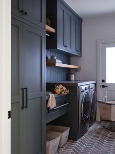 a washer and dryer in a small room