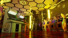 a man standing in the middle of a room filled with arcade machines and colorful lights