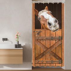 a horse sticking its head out of a barn door shower curtain that is hanging on the side of a bathroom wall