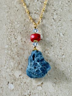 Natural Blue Coral pendant accented with a red coral rondelle shape bead and 6MM light sapphire blue Swarovski crystal and gold pyrite rosary chain.  Handmade GIFT BOXED Coral Faceted Beads Jewelry As Gift, Coral Faceted Beads Jewelry For Gifts, Red Faceted Beads Jewelry For Beach, Faceted Red Coral Beads Jewelry Gift, Blue Gemstone Jewelry For The Beach, Beach Jewelry With Red Gemstone Beads, Beach Red Gemstone Beads Jewelry, Red Gemstone Beads Jewelry For Beach, Handmade Red Coral Jewelry For The Beach